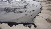 A Shell tailings pond at their tar sands operations near Fort McMurray, Alberta, September 17, 2014. Shell is one of the largest producers of crude oil in northern Alberta. Picture taken September 17, 2014. REUTERS/Todd Korol (CANADA - Tags: ENERGY ENVIRONMENT) - RTR47FSF